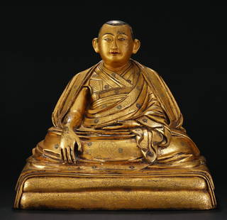 Gilt Bronze Figure Of Buddha With Calligraphy: Gilt Bronze Figure Of Buddha With Calligraphy Seat Buddha in long flowing robe holding gold bar Inscribed calligraphy along alter Dimension: