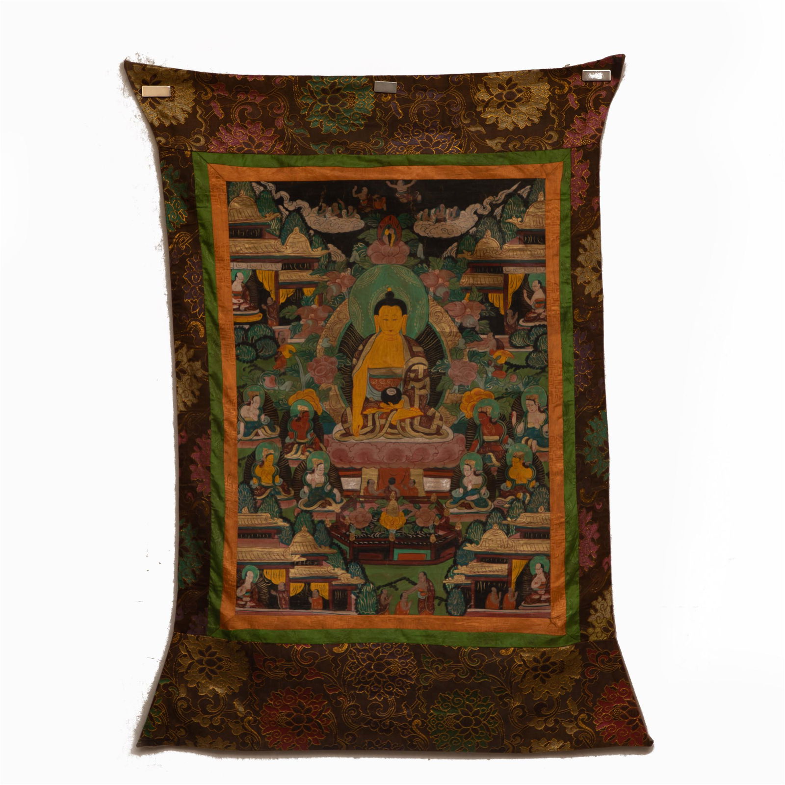 A TIBETAN THANGKA OF SHAKYAMUNI: A TIBETAN THANGKA OF SHAKYAMUNI The figure is seated in dhyanasana on a lotus base, with his right hand in bhumisparsamudra, his left hand in dhyanamudra, wearing a softly pleated robe draped over the