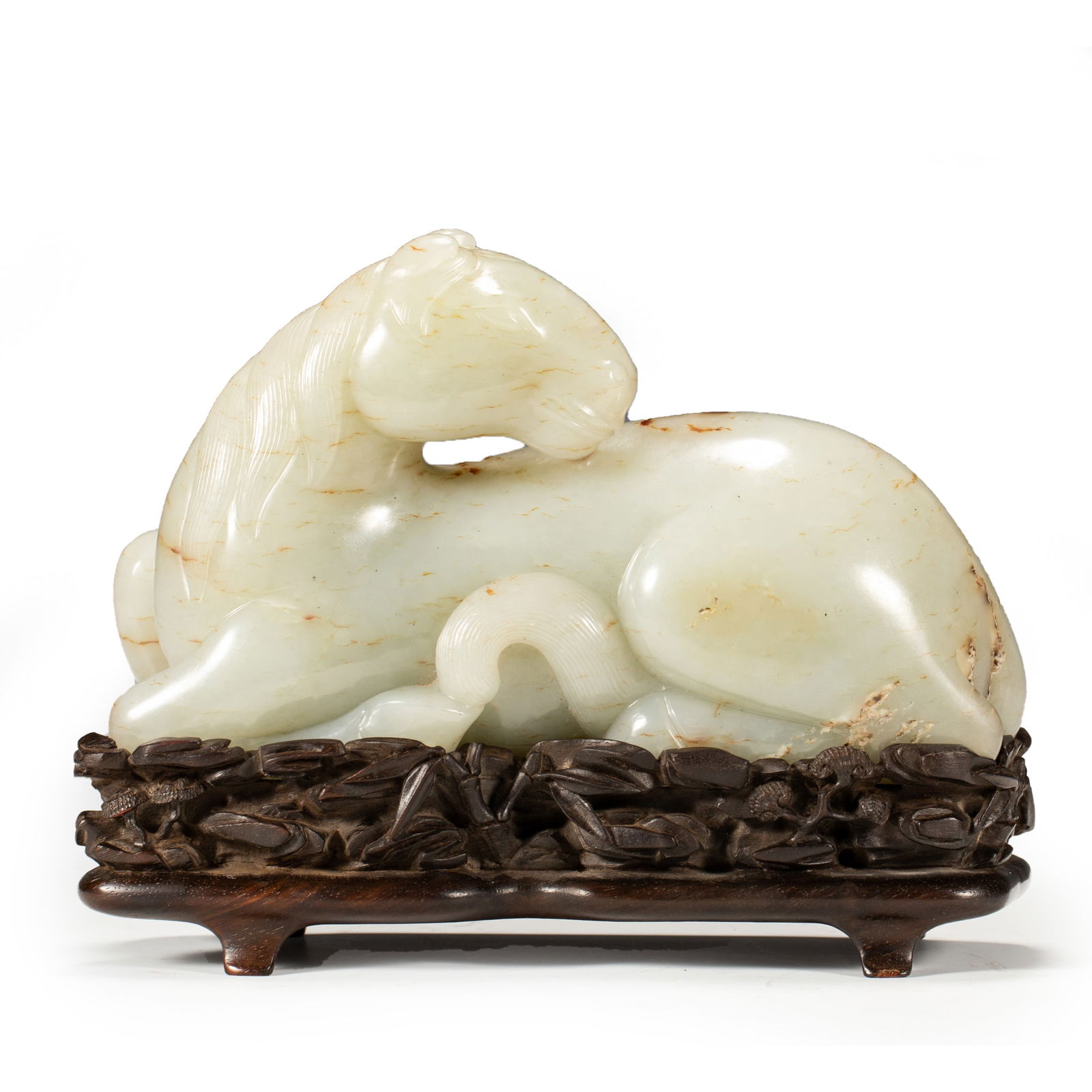 A WELL-CARVED WHITE JADE FIGURE OF A RECUMBENT HORSE (1 of 10)