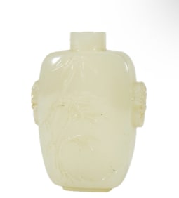 A CARVED WHITE JADE SNUFF BOTTLE