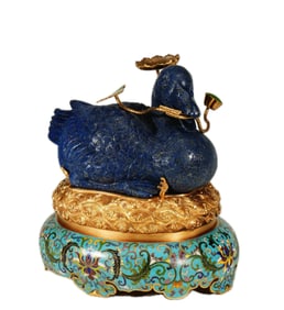 A CARVED LAPIS DUCK