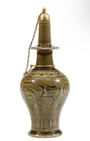 A CHINESE INCISED YAOZHOU TYPE HOLY WATER VASE GANLU PING