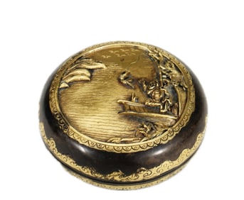 A BRONZE PARTLY GILT CIRCULAR BOX WITH COVER