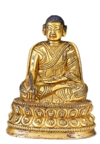 A TIBETAN BRONZE-GILT SEATED LAMA
