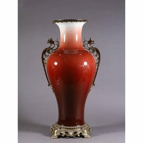AN ORMOLU MOUNTED COPPER RED VASE