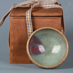 A PURPLE SPLASHED JUN-WARE BUBBLE BOWL