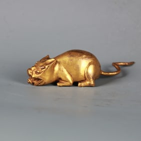 A TIBETAN BRONZE-GILT JEWEL MONGOOSE