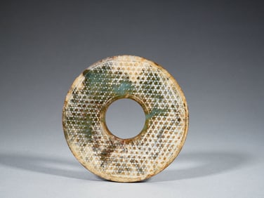 A FINE CARVED JADE DISC BI