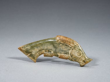 A CARVED JADE FISH-FORM PENDANT