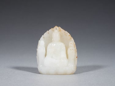 A FINE CARVED WHITE JADE BUDDHA
