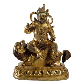 A SINO-TIBETAN BRONZE-GILT GOD OF WEALTH