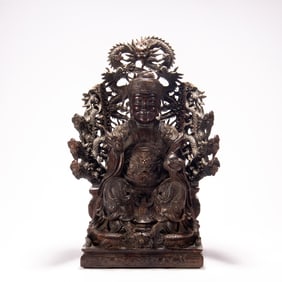 A FINE CARVED ROSEWOOD SEATED FIGURE