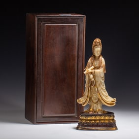 A CARVED SHOUSHAN STONE STANDING GUANYIN