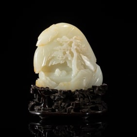 A CARVED WHITE JADE DECORATION