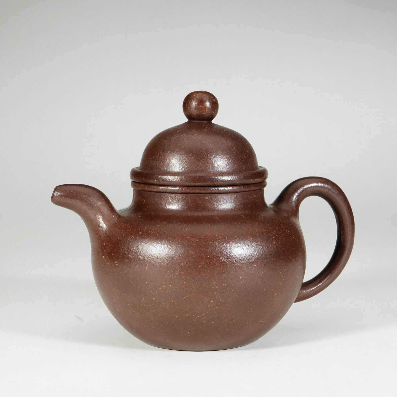 A YIXING GLAZE ZISHA TEAPOT (1 of 8)