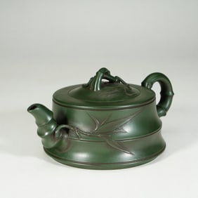 A YIXING GLAZE ZISHA TEAPOT