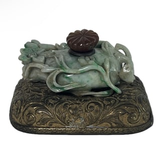 A CARED JADEITE WITH BROZNE BASE