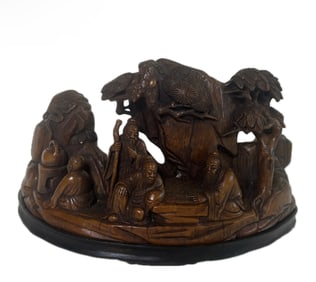 A CARVED BAMBOO DECORATION