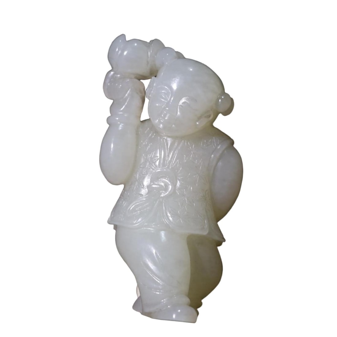 A WHITE JADE FIGURE OF A BOY HOLDING A LOTUS (1 of 9)