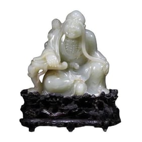 A FINE HETIAN JADE FIGURE OF A LUOHAN