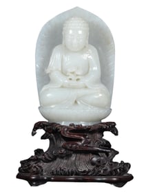 CHINESE WHITE JADE FIGURE OF A SEATED BUDDHA