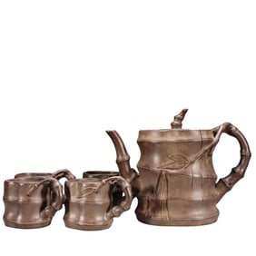 A YIXING ZISHA “BAMBOO AND GOURD” TEAPOT SET