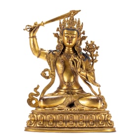 A BRONZE-GILT SEATED MANJUSRI