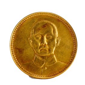 A SILVER-GILT COIN