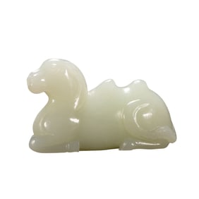 A CARVED WHITE JADE CAMEL