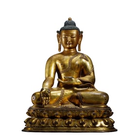 A BRONZE-GILT MEDICINE BUDDHA