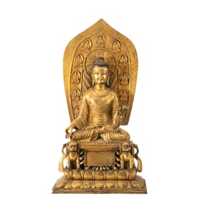 A BRONZE-GILT SEATED BUDDHA
