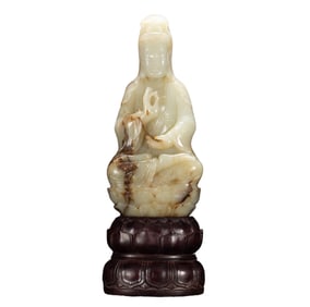 A CARVED WHITE JADE GUANYIN
