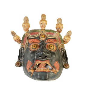 A TIBETAN PAINTED PAPIER-MACHE MASK OF MAHAKALA