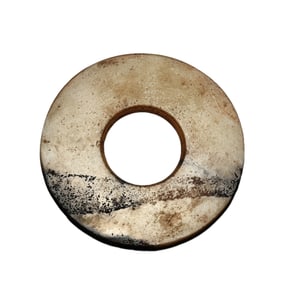 A JADE CARVING OF DISC BI