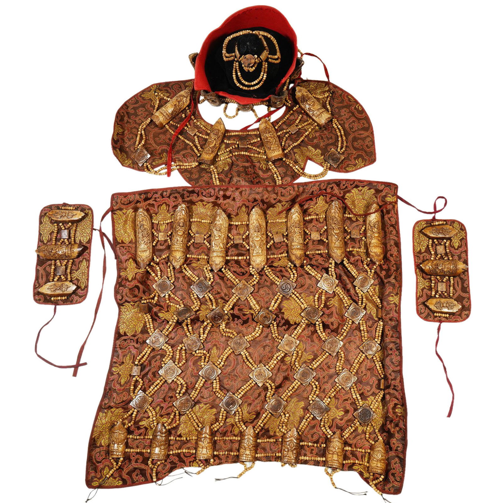AN IMPORTANTE SET OF TIBETAN RITUAL BONE APRON LEAVES: AN IMPORTANTE SET OF TIBETAN RITUAL BONE APRON LEAVES Including a hat, a collar, pair wrist bands and a belt. The belt set with seven oblong plaques carved with chitipati suspending from a network of