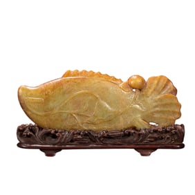 A CARVED JADE FISH