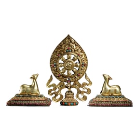 PAIR BRONZE-GILT DEER WITH DHAMA WHEEL