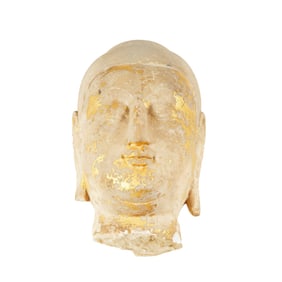 A CARVED MARBLE BUDDHA HEAD