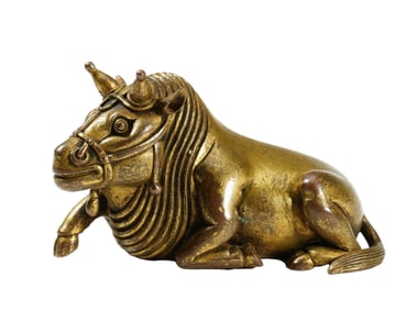 A BRONZE-GILT BUFFALO