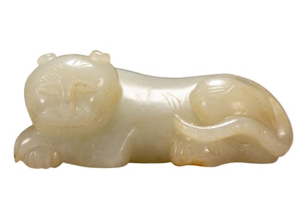 A CARVED WHITE JADE TIGER