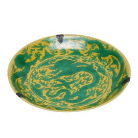 A YELLOW GROUND AND GREEN ENAMELED DRAGON DISH