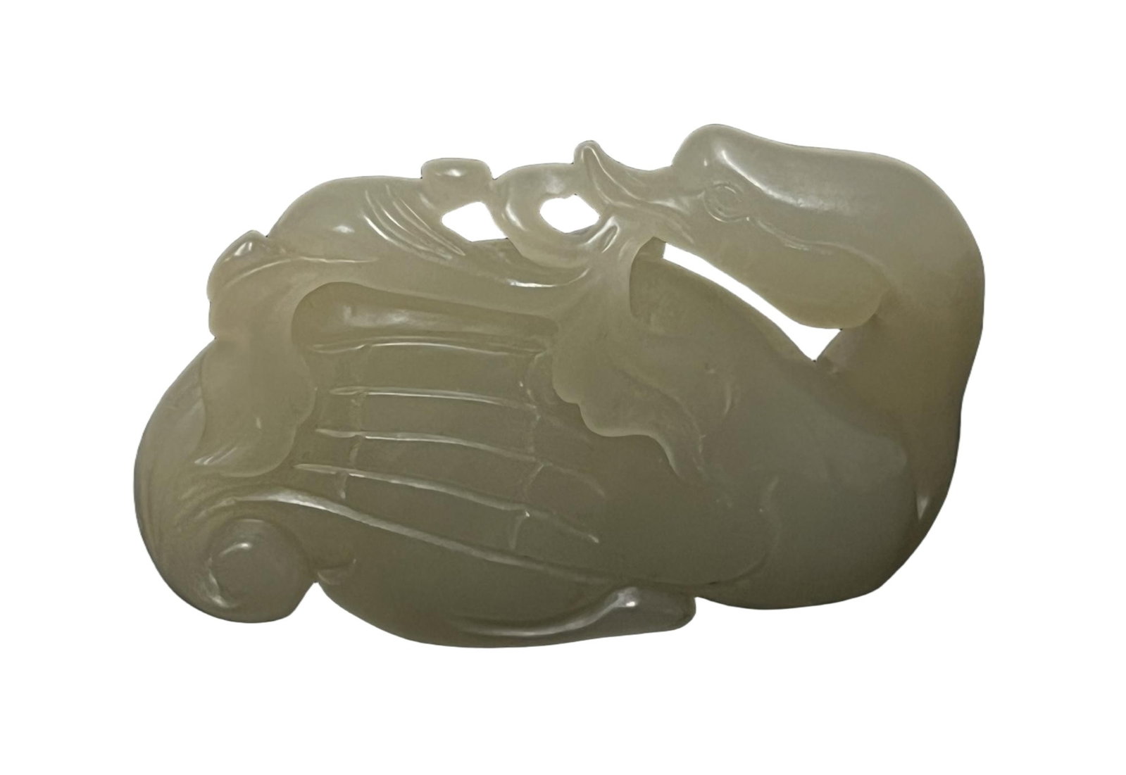 A CARVED WHITE JADE CRANE: A CARVED WHITE JADE CRANE Carved in round, the stone is of pale tone. DIMENSION: A LIST OF RECOMMENDED THIRD-PARTY SHIPPER IS AVAILABLE UNDER SHIPPING INFORMATION. PLEASE FEEL FREE TO CONTACT THEM FOR