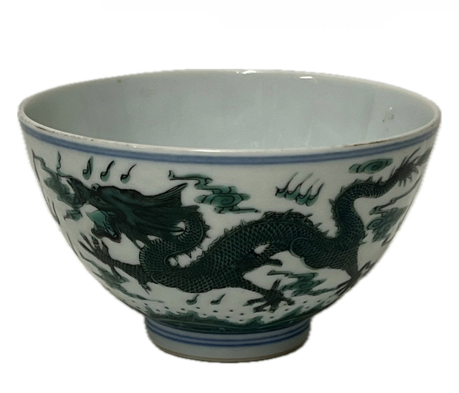 AN UNDER GLAZE BLUE AND GREEN ENAMELED BOWL WITH MARK: AN UNDER GLAZE BLUE AND GREEN ENAMELED BOWL WITH MARK Decorated with walking dragon chasing flaming pearl at the exterior. FROM NEW YORK COLLECTOR. DIMENSION: Caliber. 11 cm. H. 7 cm. A LIST OF RECOMM