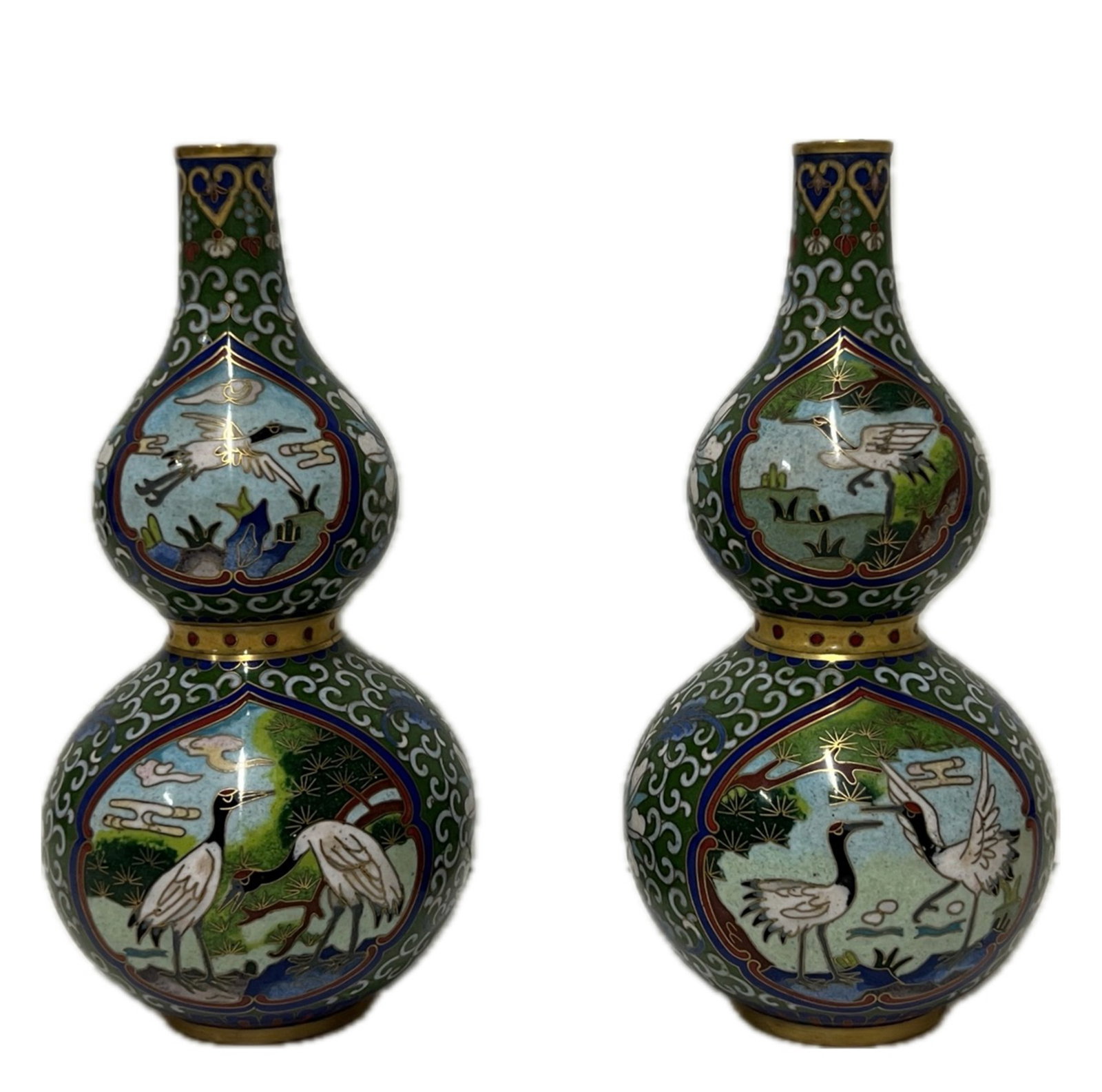 PAIR CLOISONNE ENAMEL CRANES VASES: PAIR CLOISONNE ENAMEL CRANES VASES Comprising upper and lower bulbs, decorated with cans at the reserved windows. DIMENSION: H. 17 cm. A LIST OF RECOMMENDED THIRD-PARTY SHIPPER IS AVAILABLE UNDER SHIP