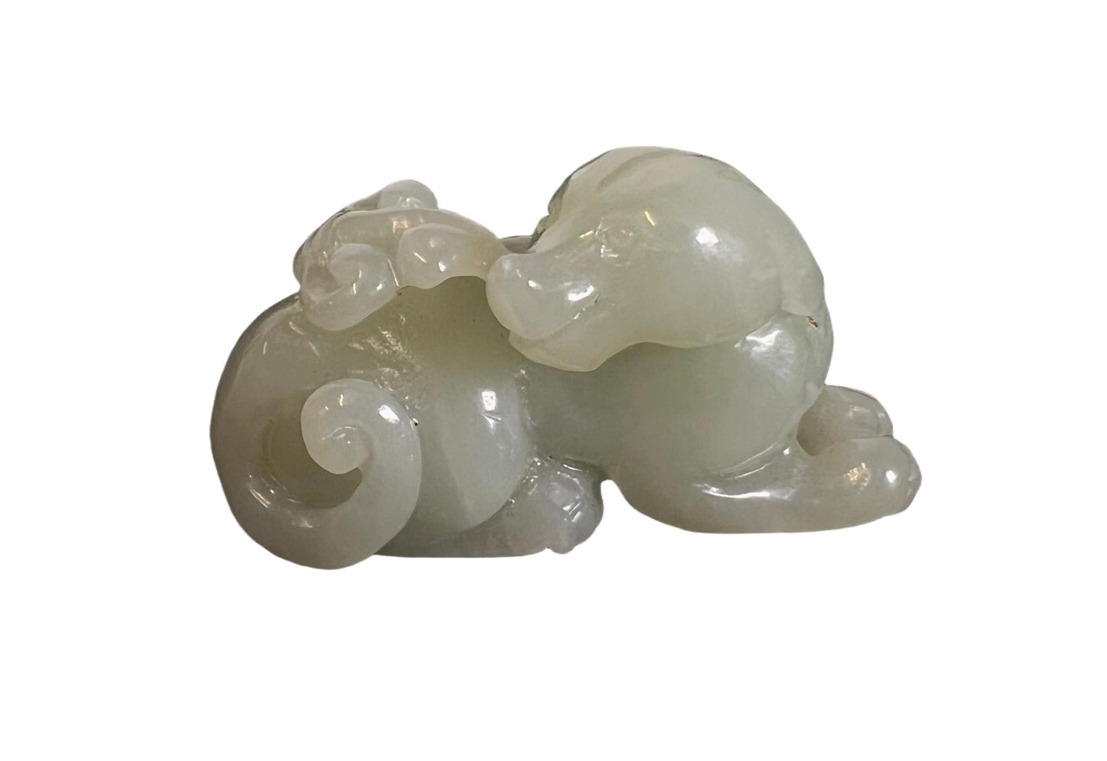 A CARVED WHITE JADE HOUND (1 of 7)