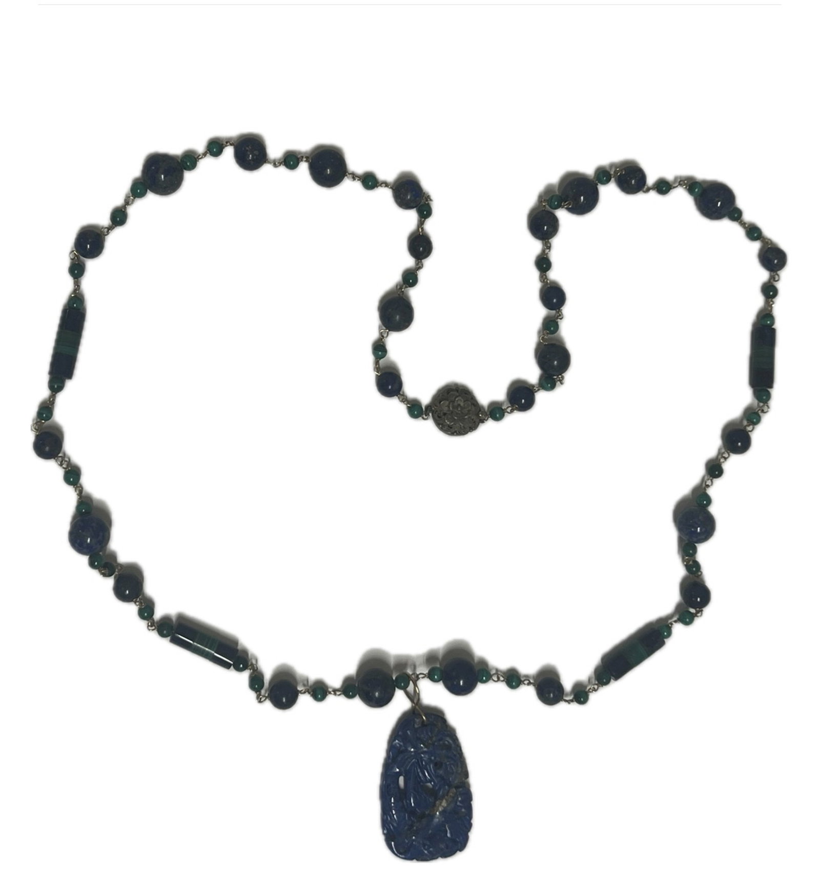A CARVED LAPIS NECKLACE: A CARVED LAPIS NECKLACE Carved by lapis boulder. DIMENSION: A LIST OF RECOMMENDED THIRD-PARTY SHIPPER IS AVAILABLE UNDER SHIPPING INFORMATION. PLEASE FEEL FREE TO CONTACT THEM FOR A QUOTE.
