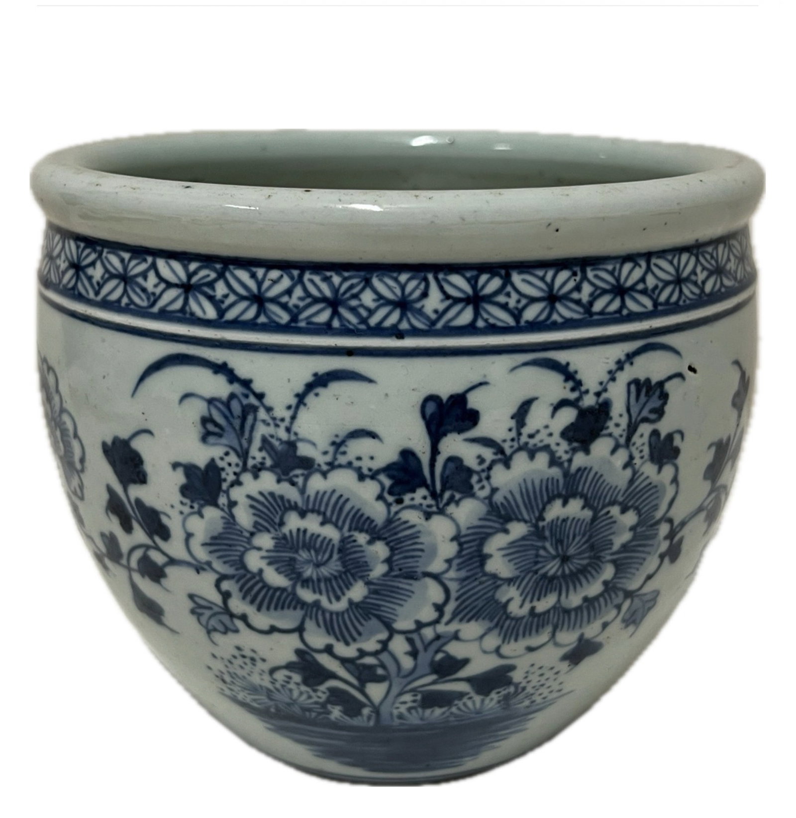 A BLUE AND WHITE PEONY JARDINIERE: A BLUE AND WHITE PEONY JARDINIERE Decorated with peony among garden at the exterior. DIMENSION: H. 14 cm. A LIST OF RECOMMENDED THIRD-PARTY SHIPPER IS AVAILABLE UNDER SHIPPING INFORMATION. PLEASE