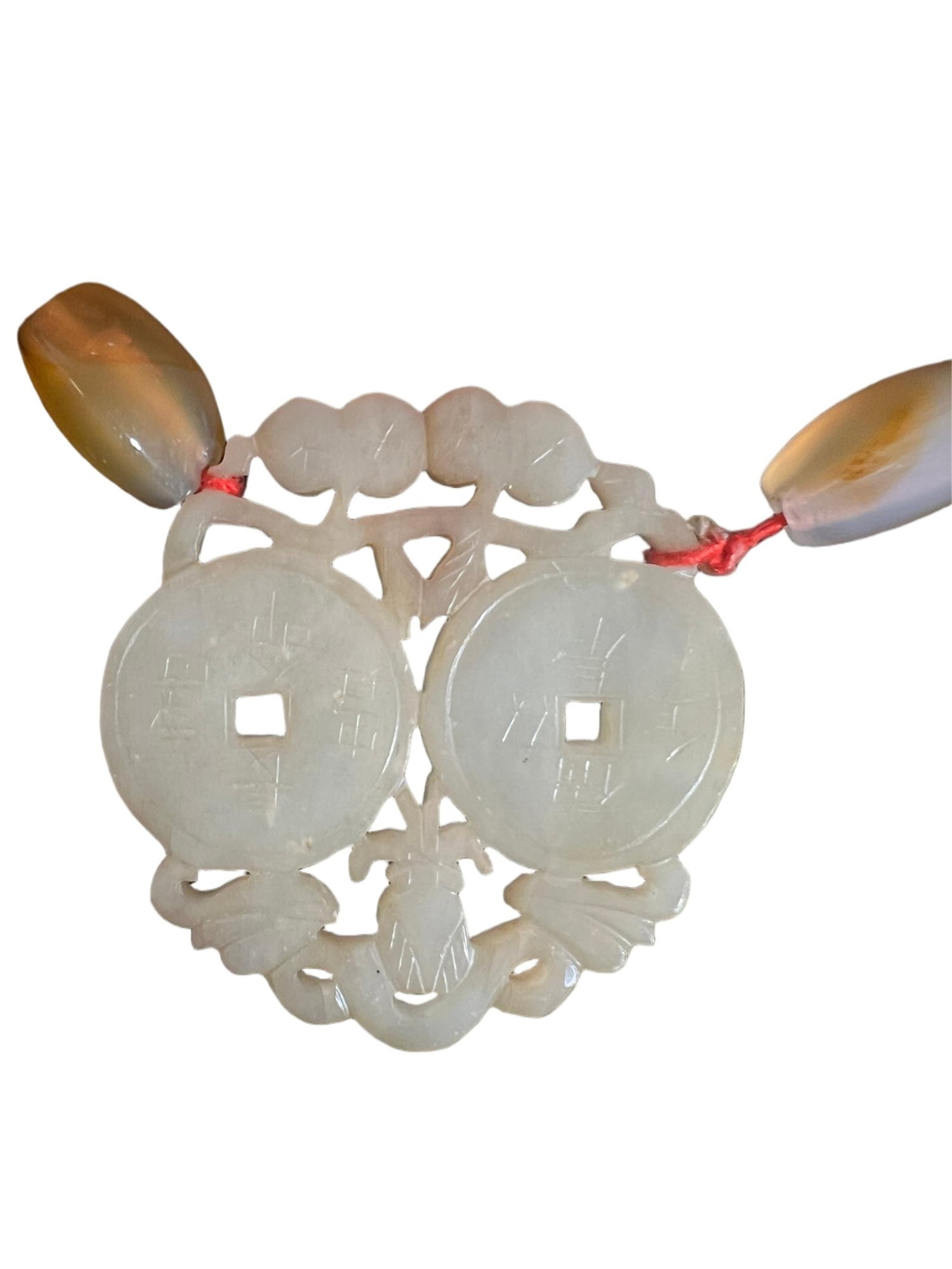 A CARVED WHITE JADE PENDANT: A CARVED WHITE JADE PENDANT The stone is of white tone. DIMENSION: Diam. 6 cm. A LIST OF RECOMMENDED THIRD-PARTY SHIPPER IS AVAILABLE UNDER SHIPPING INFORMATION. PLEASE FEEL FREE TO CONTACT THEM FOR