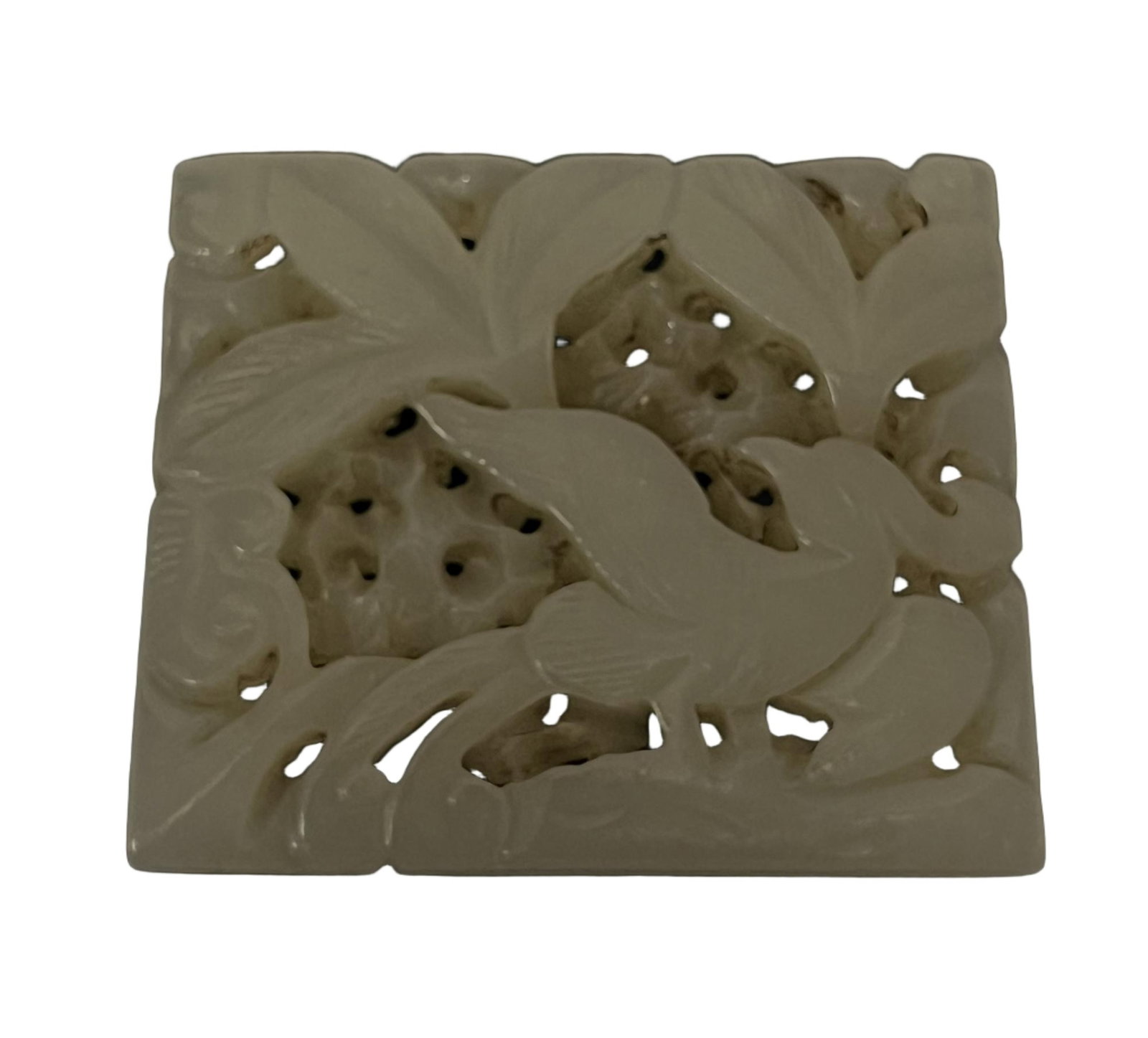 A CARVED WHITE JADE PLAQUE: A CARVED WHITE JADE PLAQUE Of rectangular shape, carved and reticulated with pheasant in garden DIMENSION: A LIST OF RECOMMENDED THIRD-PARTY SHIPPER IS AVAILABLE UNDER SHIPPING INFORMATION. PLEASE