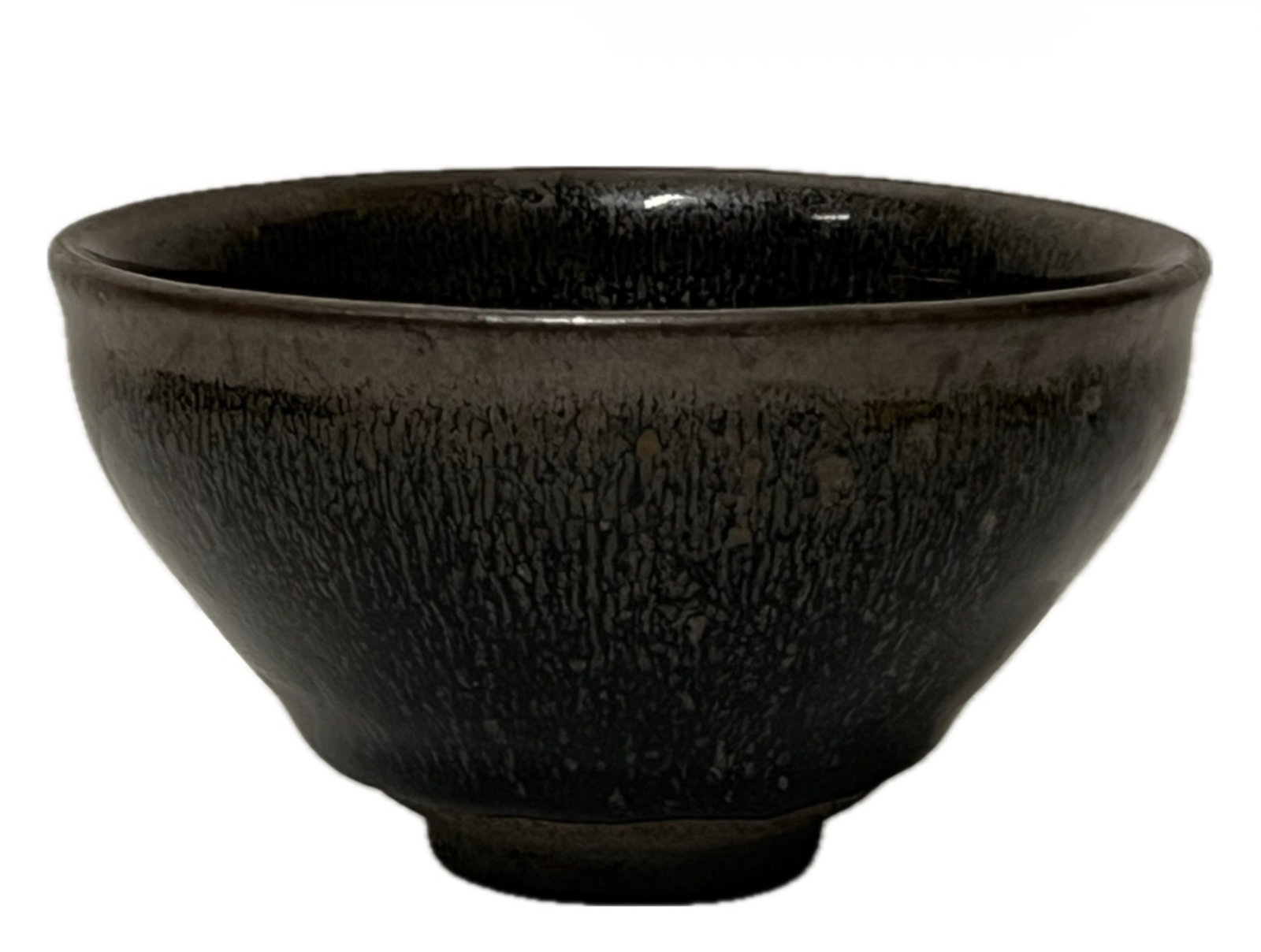 A JIAN-WARE TEA BOWL: A JIAN-WARE TEA BOWL Applied with aubergine glaze. FROM NEW YORK COLLECTOR. DIMENSION: Caliber. 12 cm. H. 7 cm. A LIST OF RECOMMENDED THIRD-PARTY SHIPPER IS AVAILABLE UNDER SHIPPING INFORMATION.